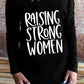 RAISING STRONG WOMEN Graphic V-Neck Top