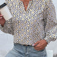 Printed Notched Neck Ruffled Lantern Sleeve Blouse